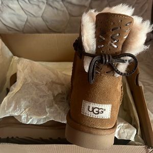 UGGS Mini with leather ties.